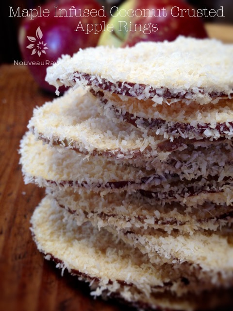 raw vegan Maple Infused Coconut Crusted Apple Rings stacked in a pile
