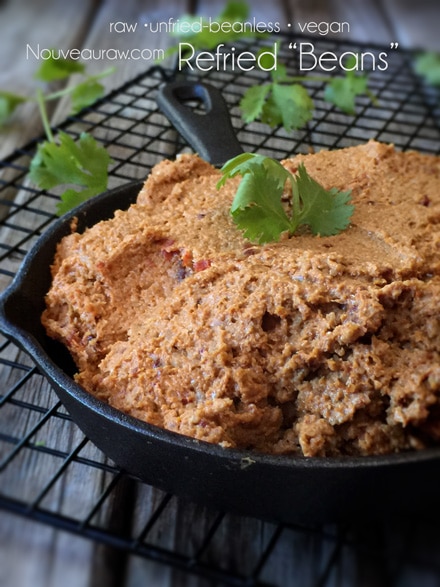 raw vegan refried beans served in a cast iron pan