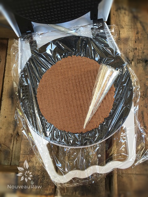 lift the lid to expose the waffle shape to wrap around the cone