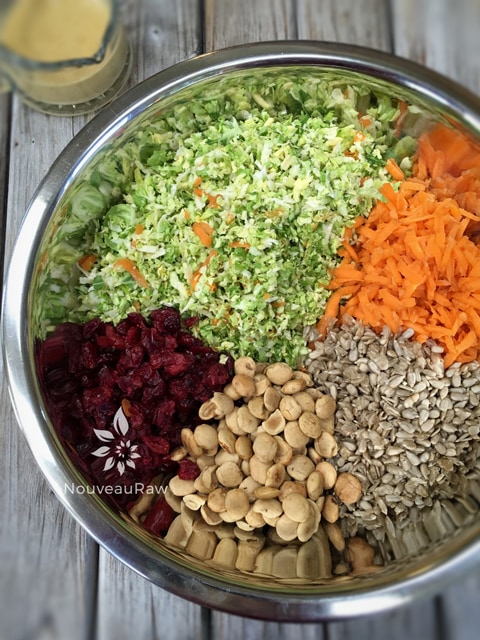 preparing the ingredients to make raw vegan Toasted Sesame Shredded Brussel Sprout Salad 