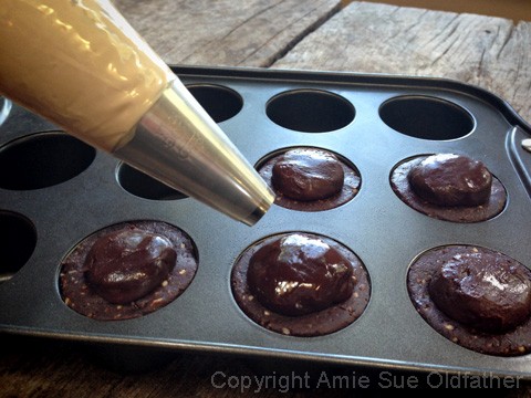 Place the frosting in a piping bag fitted with medium-sized circular tip