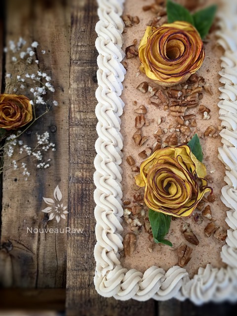 Add crushed pecans in the center and place the peach roses on top.