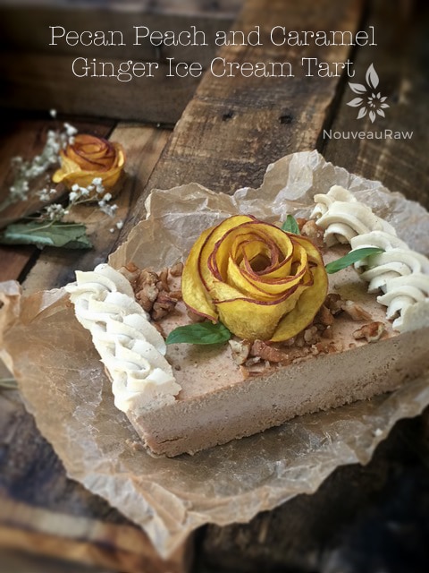 a singler slice of raw vegan Pecan Peach and Caramel Ginger Ice Cream Tart served on a wooden table 