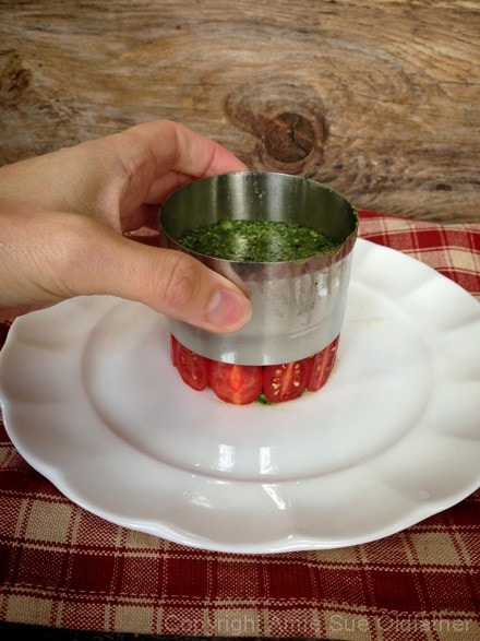 slowly removing the molding ring from the Raw-Cilantro-and-Spinach-Cashew-Pesto