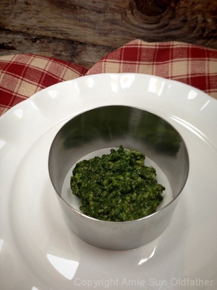 place a dollop of pesto in the base of the ring