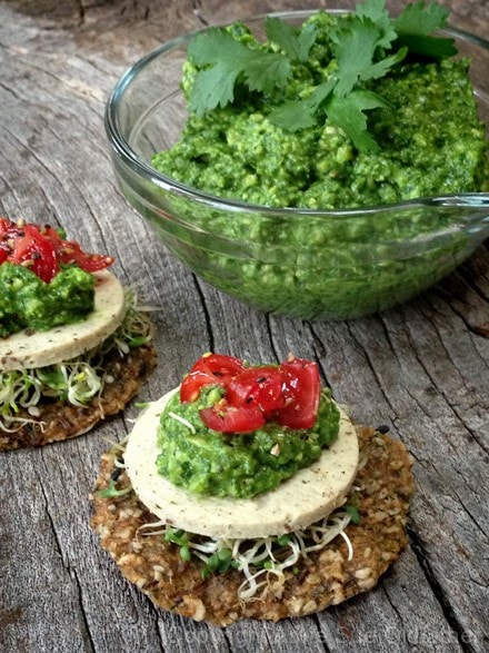 Raw-Cilantro-and-Spinach-Cashew-Pesto served on raw crackers