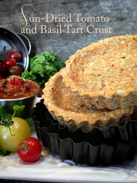 gluten free Sun-Dried Tomato and Basil Tart Crusts displayed with fresh veggies