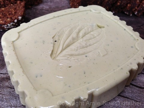 removing the leaf to leave an impression on the vegan Leek & Herb Cheese 