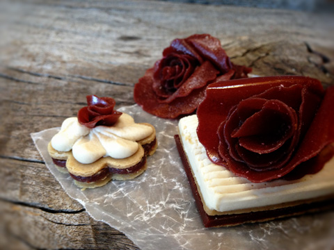 Wildberry Fruit Filled Danish Pastry on barn wood table with extra fruit leather flowers