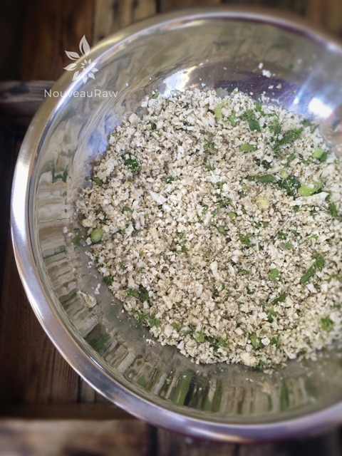 tossing the ingredients together to make Savory-Seeded-Cauliflower-'Rice' 