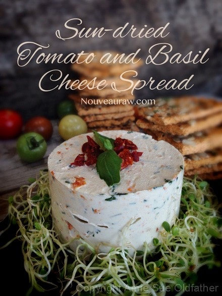raw vegan Sun-dried Tomato and Basil Cheese Spread displayed with raw crackers