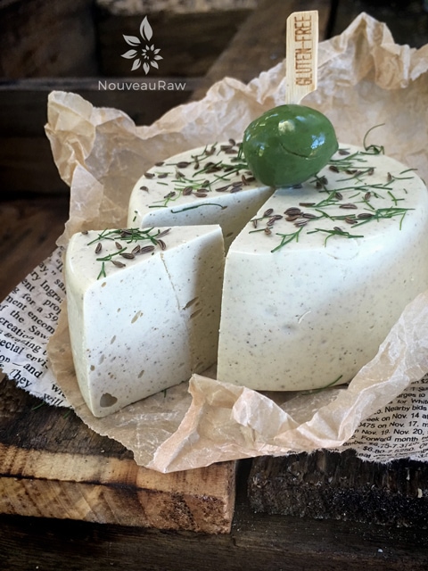 a slice of vegan whole food Caraway and Dill Cheese