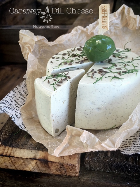 a cheese wheel of vegan whole food Caraway and Dill Cheese