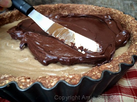 After the filling is firm, spread the ganache on top