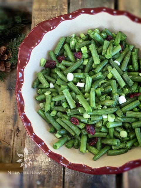 cut up green beans for the raw vegan Warm Green Bean Casserole with Buttery Walnut Crumble 