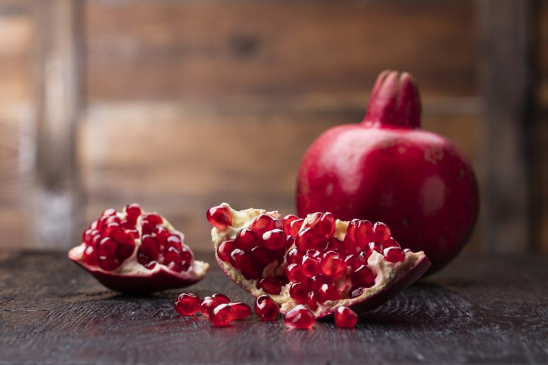 pomegranate on-wooden-table