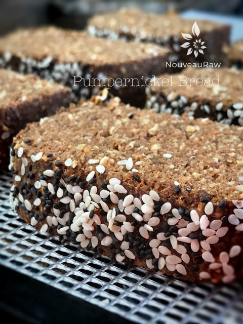 raw vegan gluten-free Pumpernickel Bread on a dehydrator tray