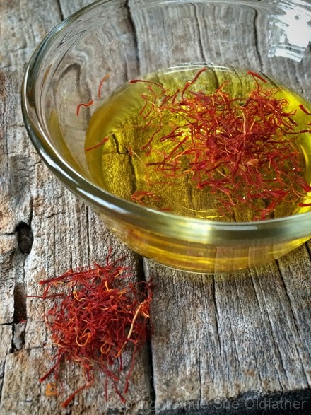 In a small bowl combine the saffron and 1/4 cup of water 