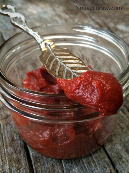 a close up Homemade Tomato Paste displayed on a wooden table