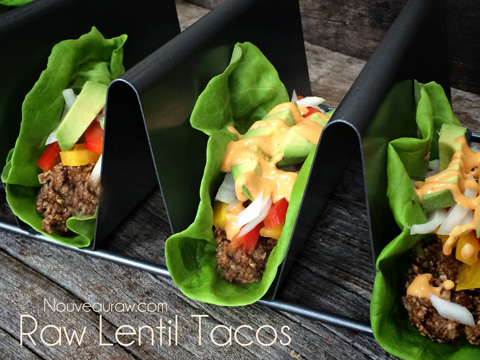 a close up of raw vegan gluten-free Lentil Tacos in a taco shell holder