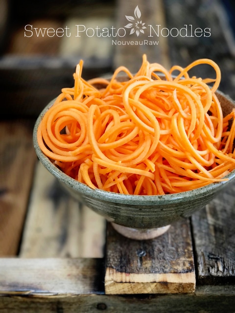 raw sweet potato noodles in a homemade ceramic bowl