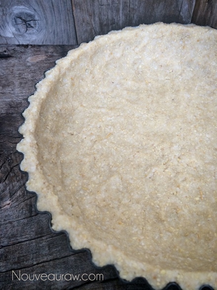 Once the edges are done, press the center of the crust down, firmly & even