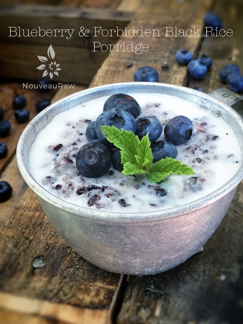 raw vegan Blueberry and Forbidden Black Rice Porridge served in a tin coffee mug