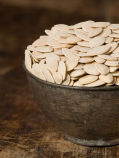 close up of pumpkin-seeds in a bowl