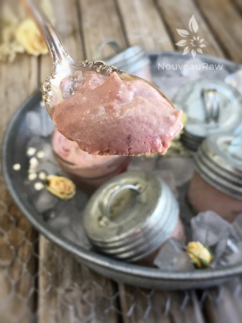 a spoonful of raw vegan Italian Balsamic and Strawberry Ice Cream displayed in a old tin dish