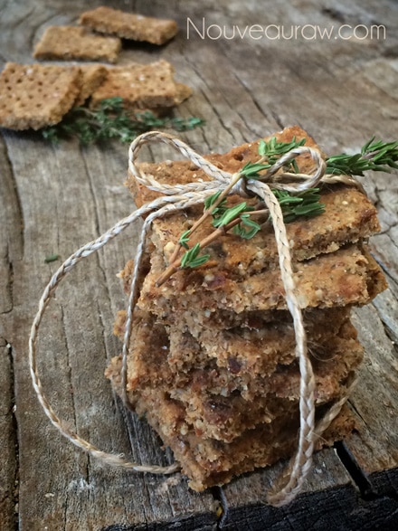 a stack of raw vegan gluten free Thyme and Pecan Coastal Crackers 