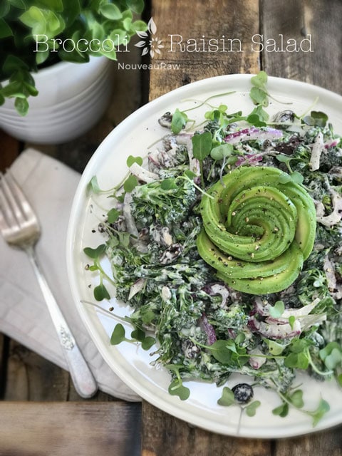 raw vegan Broccoli Raisin Salad served with an avocado flower