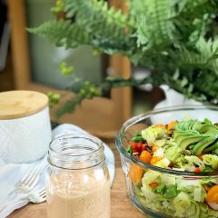 Russian-Salad-Dressing on a wooden table with a fresh salad