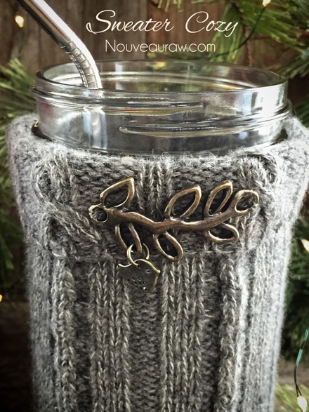 a close up of gray sweater cozy's made from recycled sweaters with stainless steel straws
