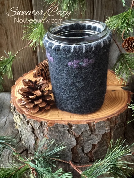 a sweater sleeve used to make a jar cozy