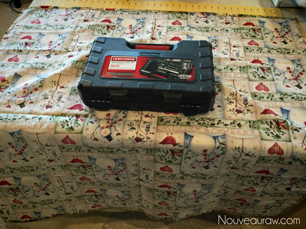 wrapping a tool kit with Christmas fabric instead of paper