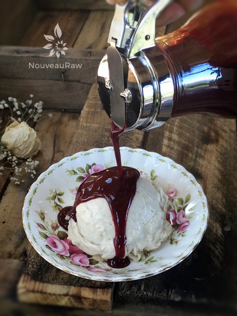 pouring Blackberry Syrup over raw vegan ice cream
