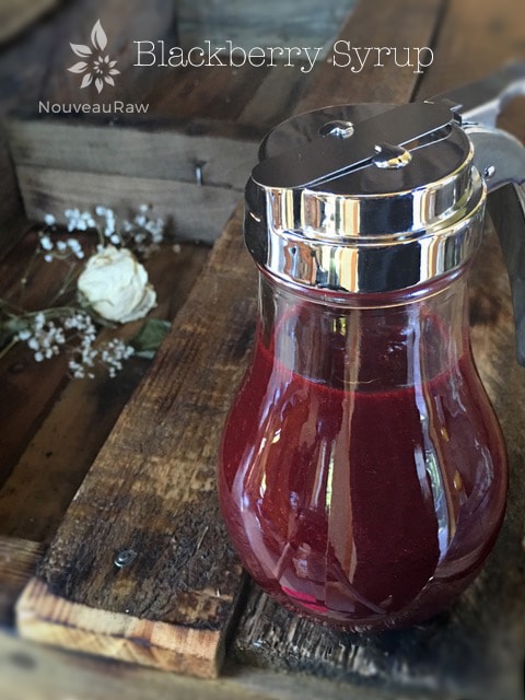 Blackberry Syrup displayed on a wooden table