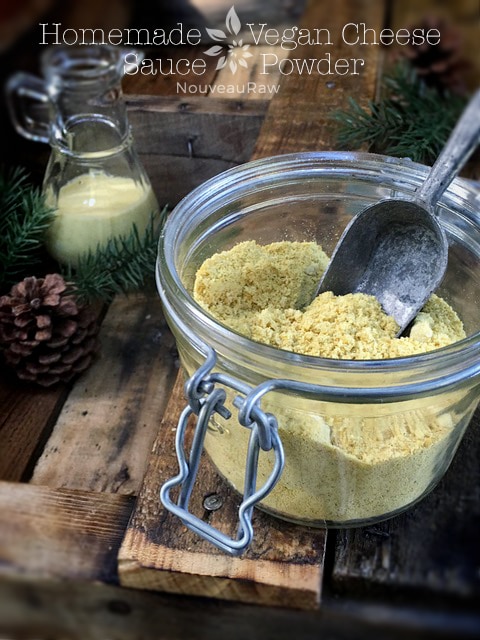  vegan Homemade Vegan Cheese Sauce Powder with a scoop in the jar