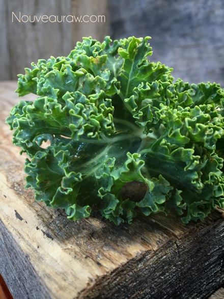 raw kale on barn wood