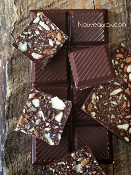 a close up a display of Raw vegan Milk Chocolate poured into chocolate bar molds