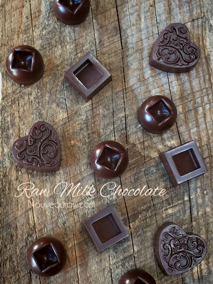 Raw Milk Chocolate in fun shapes and displayed on a wooden table