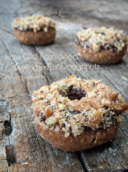 raw vegan gluten-free Old Fashioned Apple Spiced Doughnuts covered in crushed nuts