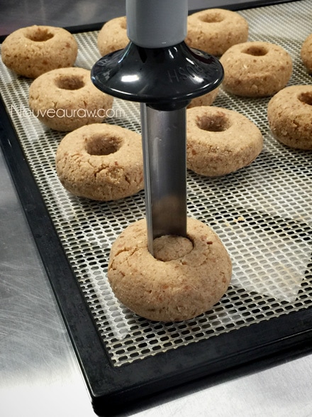 creating the hole in the shaping the raw vegan gluten-free Old Fashioned Apple Spiced Doughnuts
