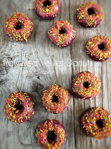 over head shot of raw vegan gluten-free Red Velvet Donuts on a wooden table