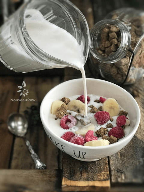 adding almond milk to Granola-Crunch'Ola-Cereal-1