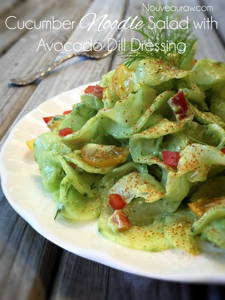 raw vegan English Cucumber Noodle Salad with Avocado Dill Dressing served on a white plate