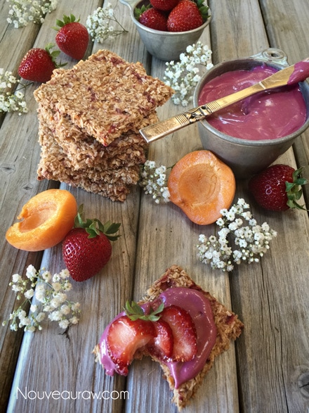 raw vegan gluten free Strawberry Apricot Coconut Crackers displayed on barn wood table