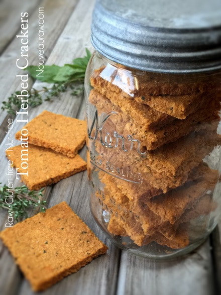 raw gluten free Tomato Herbed Crackers stored in an old mason jar 