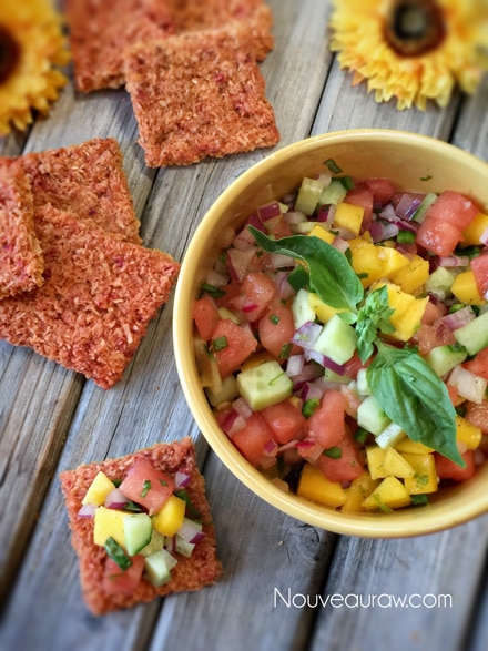an over head view of crispy fresh raw Watermelon Bliss Coconut Crackers with mango salsa