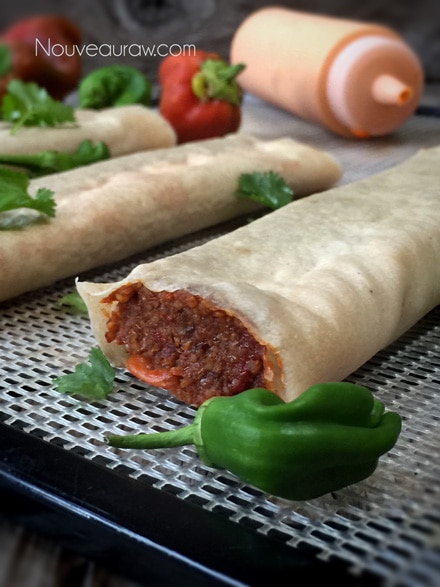 a close up side view of the raw vegan gluten-free "Refried Bean" and "Cheese" Burrito